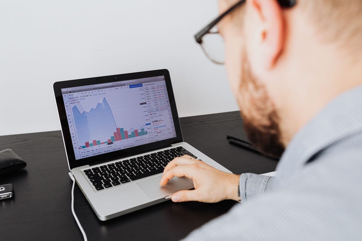 An owner reviewing growth numbers on a laptop
